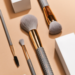 4 piece brush set: brow groomer, blending brush, tapered face brush, and kabuki brush